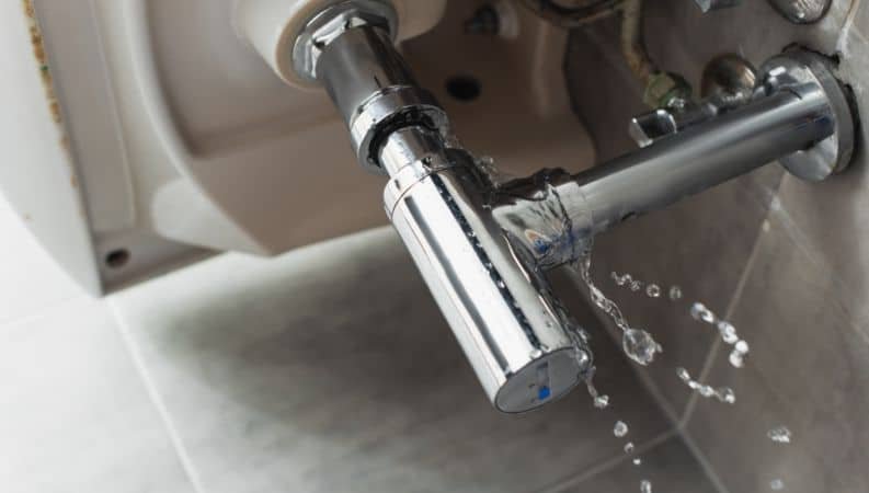 leaking steel pipe under sink with water drops 2023 11 27 05 21 51 utc